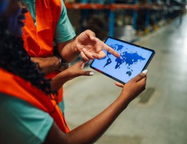 Workers reviewing global data