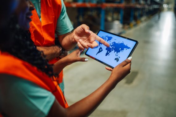 Workers reviewing global data